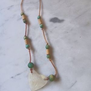 Cord, wood bead, and shell necklace
